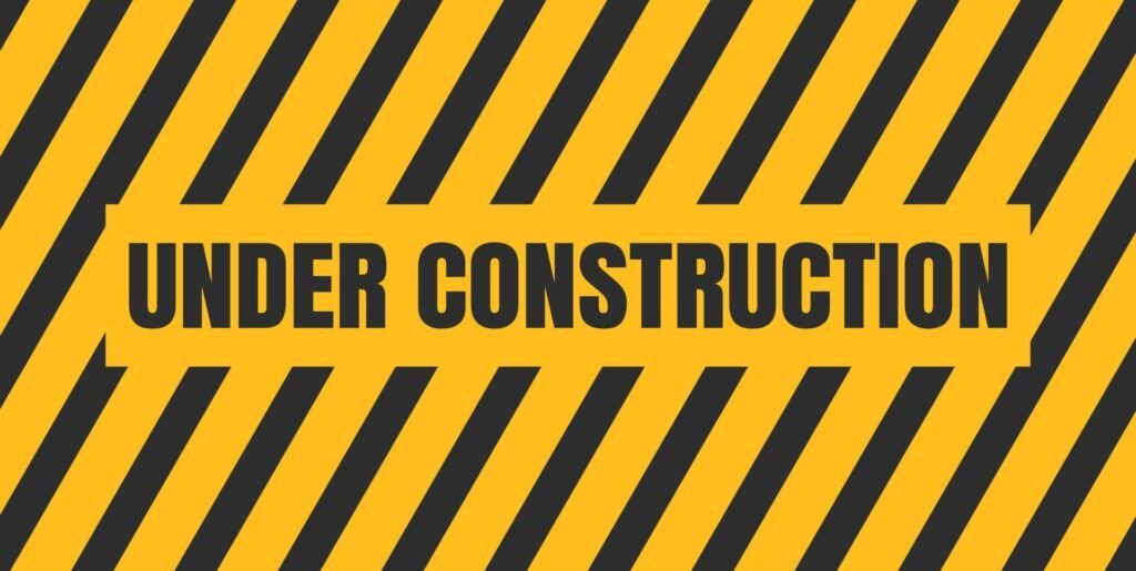 Banner stripped yellow and black with the words Under Construction in the center